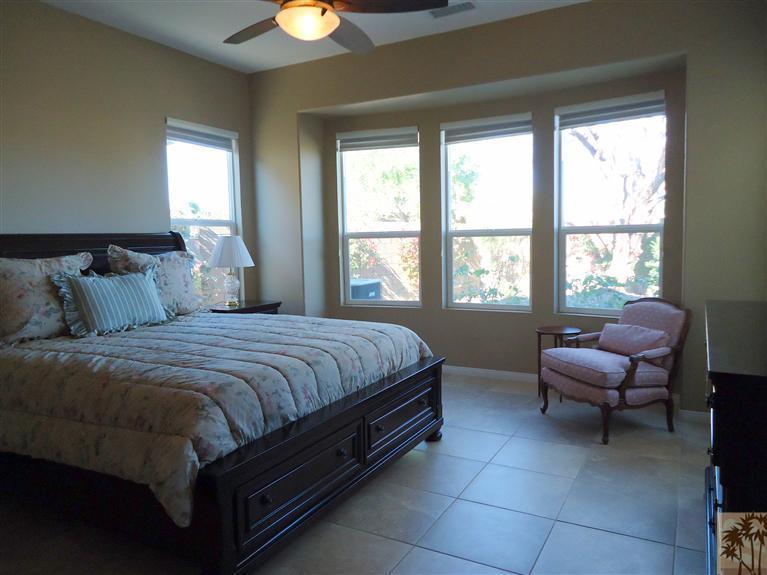 81278 Golden Barrel Way La Quinta, CA 92253 - Photo 9 of 17 a bedroom with a bed and a window