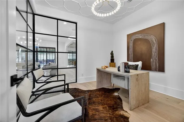 a view of a dining room with furniture window and wooden floor