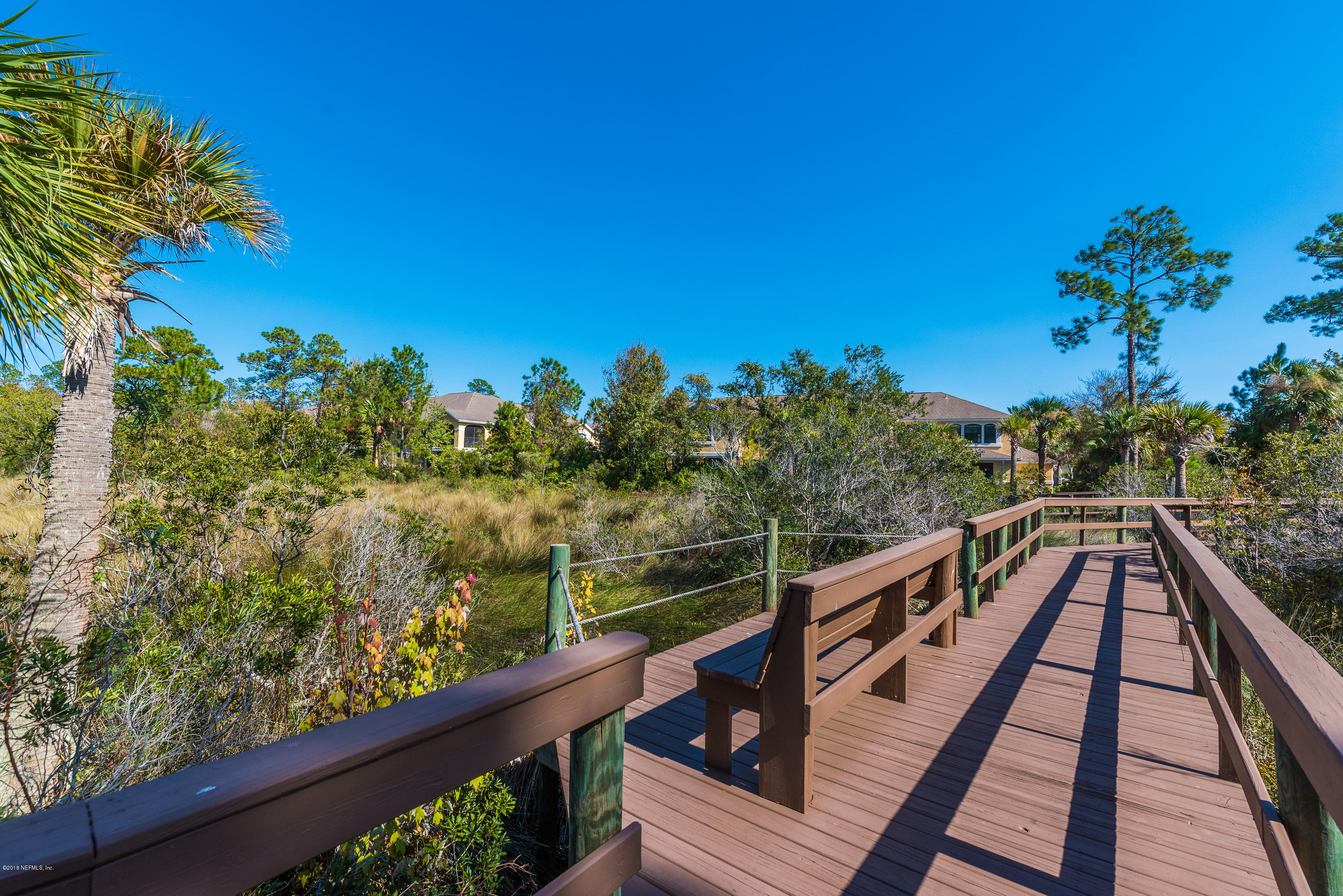3427 Haley Pointe Road St. Augustine, FL 32084 - Photo 49 of 50 a view of a balcony with wooden fence and floor