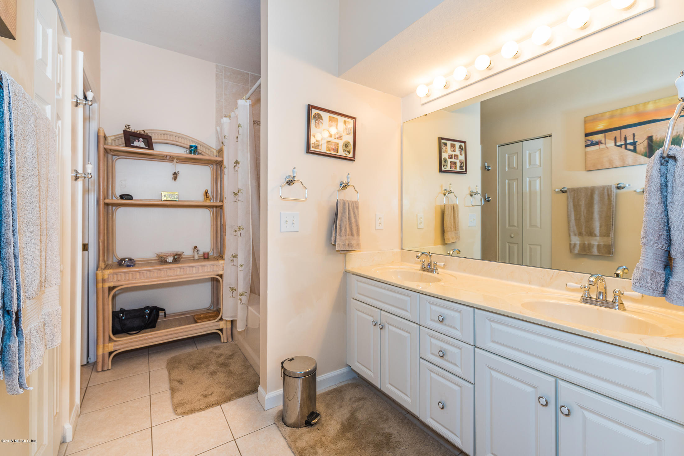 3427 Haley Pointe Road St. Augustine, FL 32084 - Photo 8 of 50 a en suite bathroom with a double vanity sink and a mirror