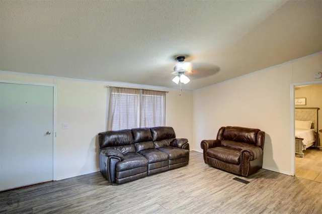 a view of kitchen with cabinets appliances and wooden floor