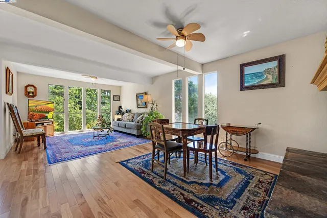 a view of a dining room with furniture window and wooden floor