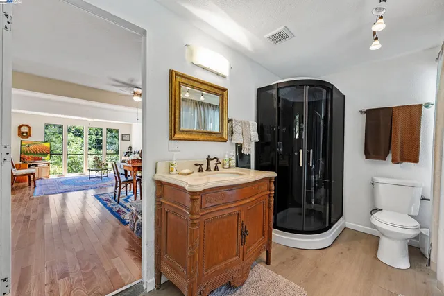 a living room with furniture a flat screen tv and a large window