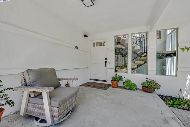a bedroom with furniture and a potted plant