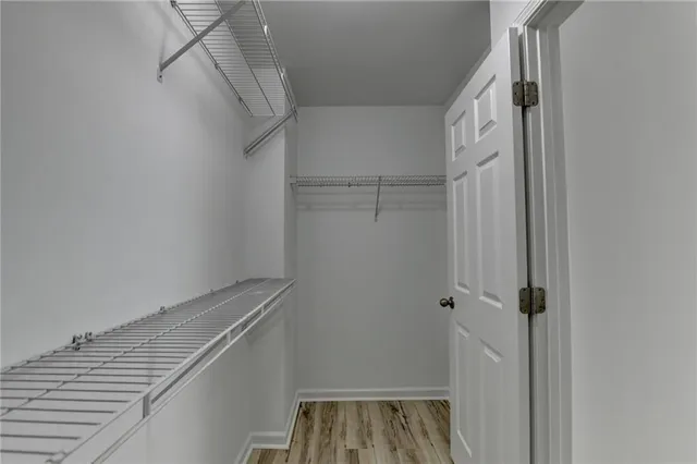 a view of storage and utility room with racks on the wall