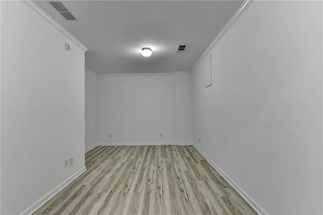 a view of room with wooden floor