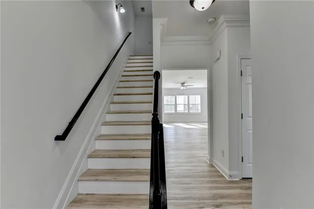 a view of an entryway with wooden floor