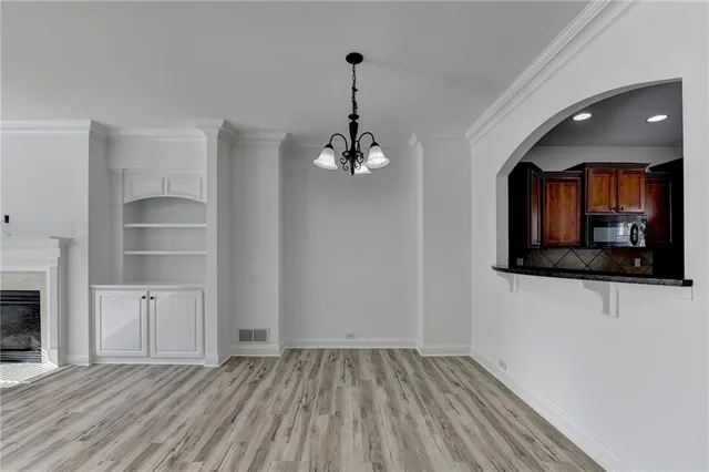 a view of a room with wooden floor and staircase