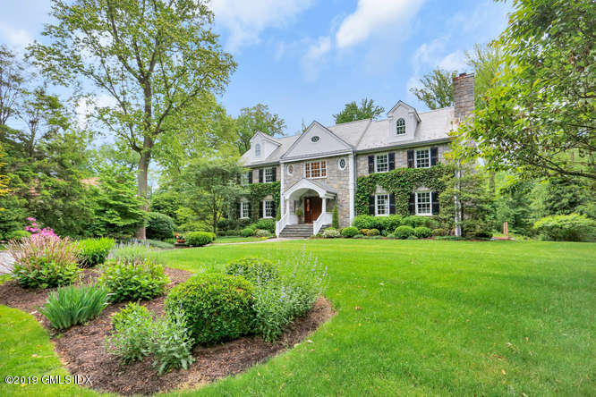 16 Normandy Lane Riverside, CT 06878 - Photo 1 of 43 a front view of a house with a yard
