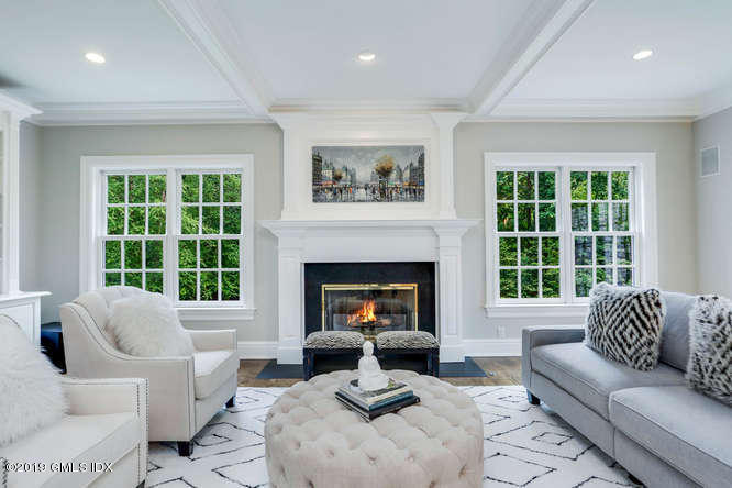 16 Normandy Lane Riverside, CT 06878 - Photo 19 of 43 a living room with furniture a window and a fireplace