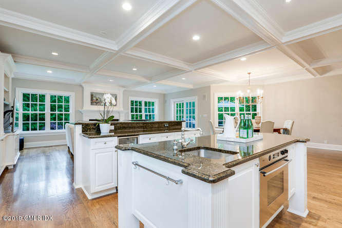 16 Normandy Lane Riverside, CT 06878 - Photo 22 of 43 a kitchen with granite countertop a sink and a stove top oven