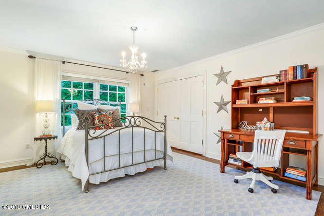 16 Normandy Lane Riverside, CT 06878 - Photo 30 of 43 a bed room with a bed and a chair