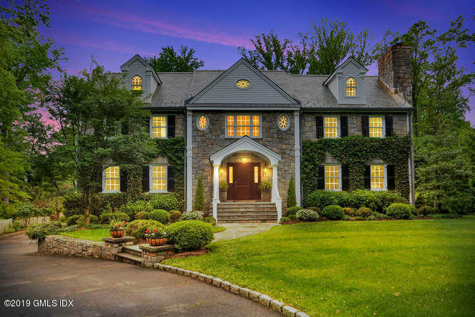 16 Normandy Lane Riverside, CT 06878 - Photo 3 of 43 a front view of a house with a garden