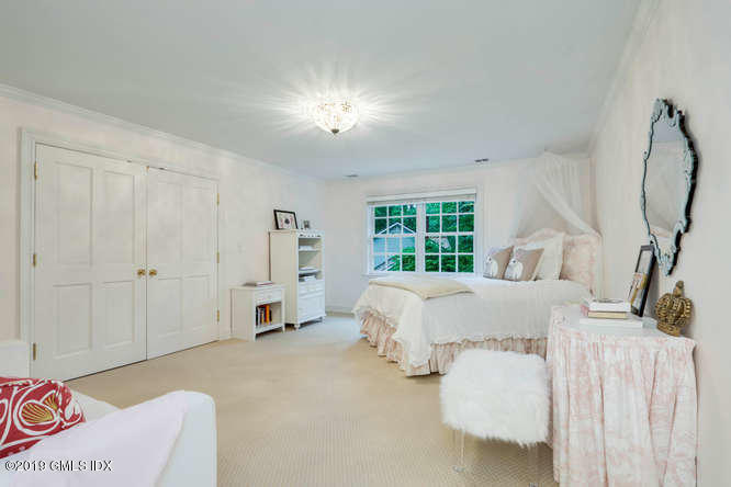 16 Normandy Lane Riverside, CT 06878 - Photo 31 of 43 a bed room with a bed and a window