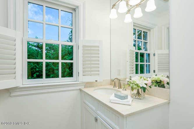 16 Normandy Lane Riverside, CT 06878 - Photo 33 of 43 a bathroom with a sink and a mirror