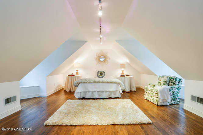 16 Normandy Lane Riverside, CT 06878 - Photo 36 of 43 a spacious bedroom with a bed and a wooden floor