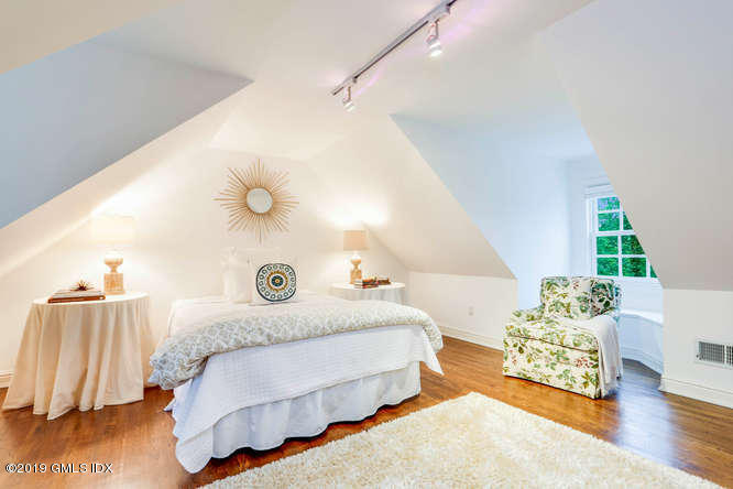 16 Normandy Lane Riverside, CT 06878 - Photo 37 of 43 a bedroom with a bed and a couch