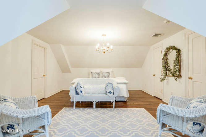16 Normandy Lane Riverside, CT 06878 - Photo 38 of 43 a living room with furniture and a table