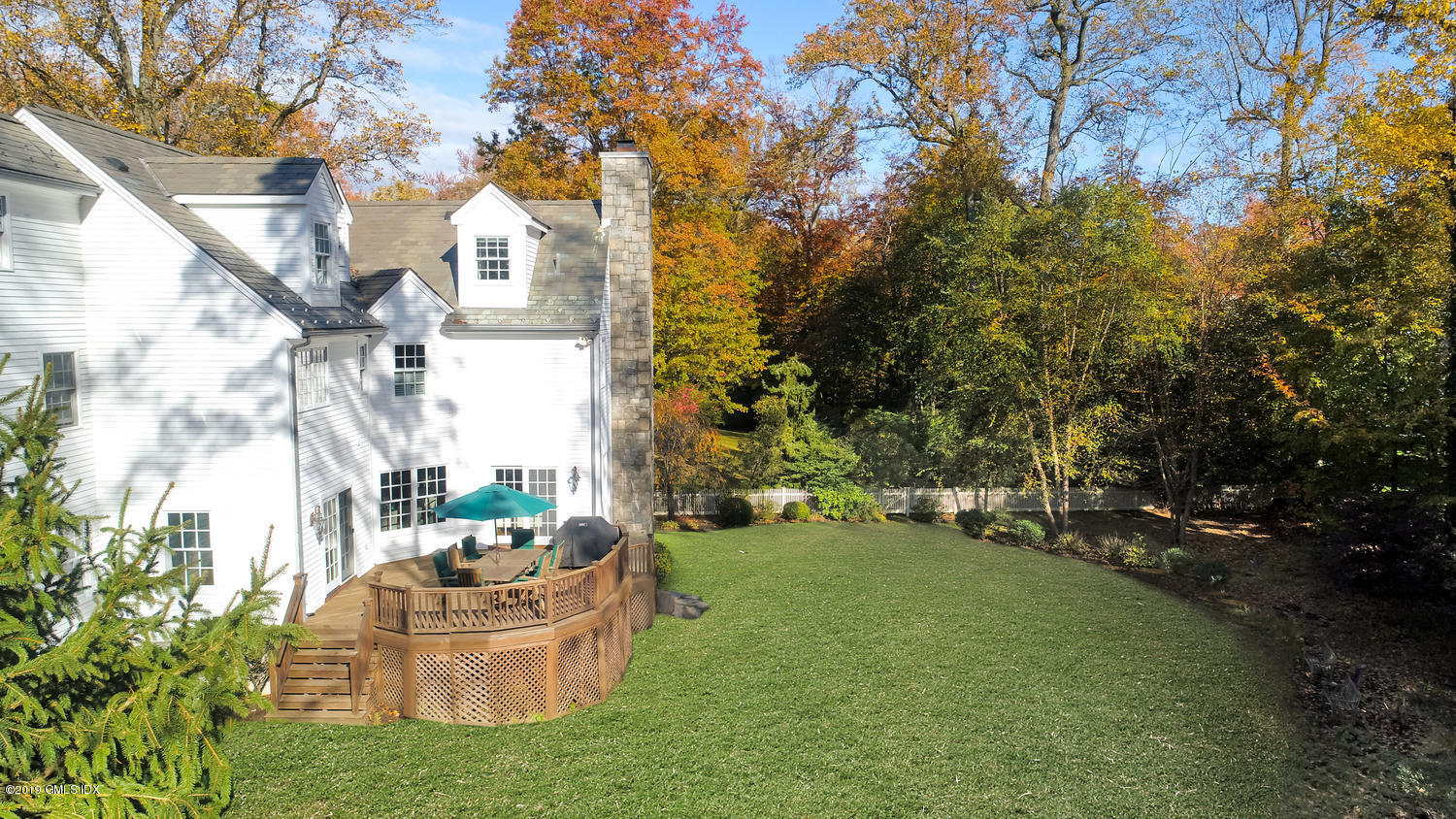 16 Normandy Lane Riverside, CT 06878 - Photo 4 of 43 a view of a fountain in the yard with large trees