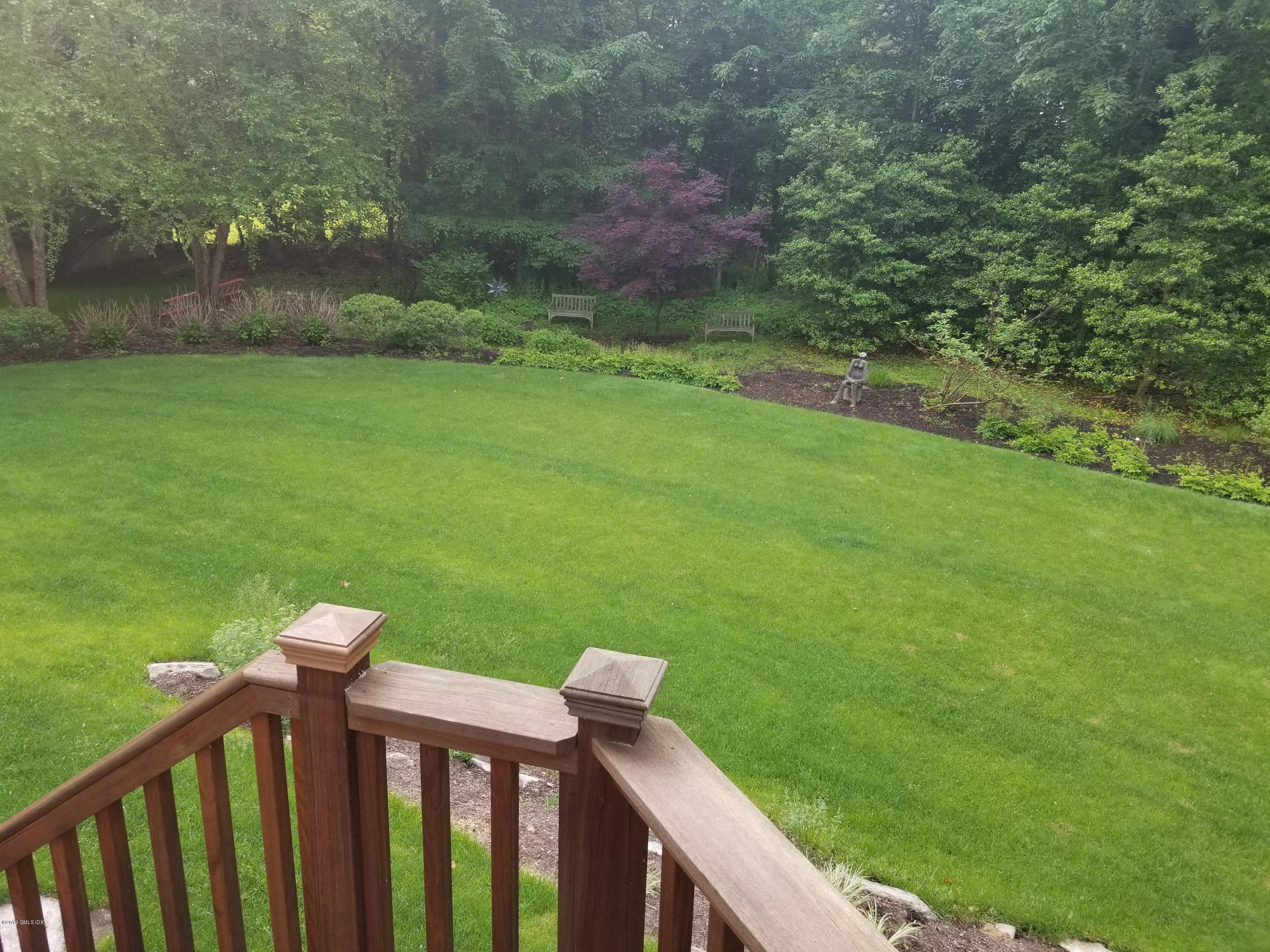 16 Normandy Lane Riverside, CT 06878 - Photo 8 of 43 a view of a wooden deck and a yard