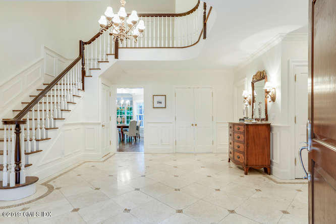 16 Normandy Lane Riverside, CT 06878 - Photo 9 of 43 a view of a hallway with entryway and hall with wooden floor