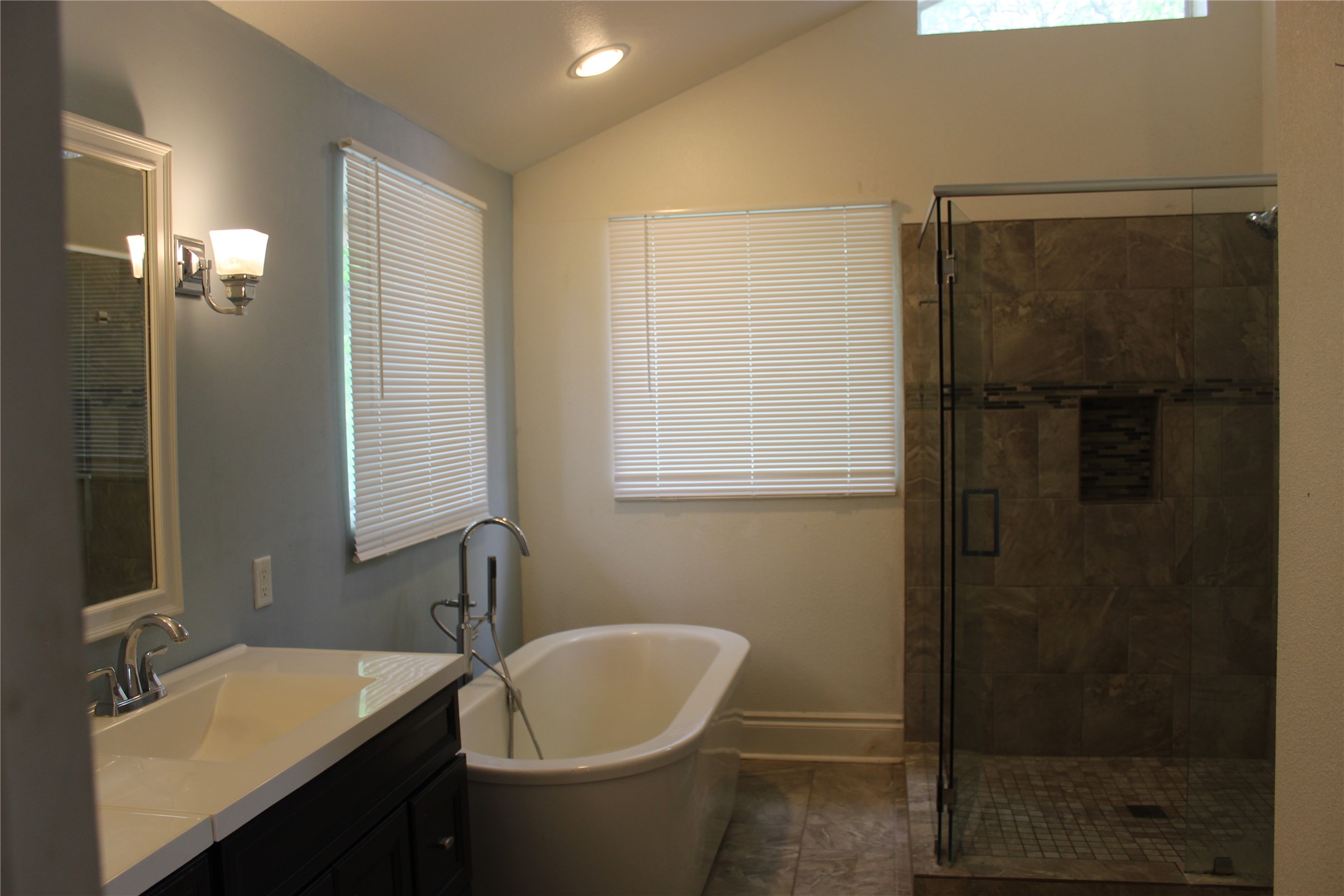 908 River Road Wimberley, TX 78676 - Photo 7 of 16 Full bath with vanity, a stall shower, a soaking tub, and lofted ceiling