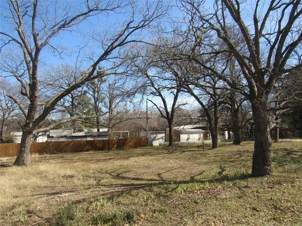 a view of yard covered with snow in front of house