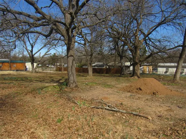 a view of yard covered with snow in front of house