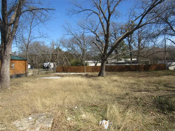a view of yard covered with snow in front of house