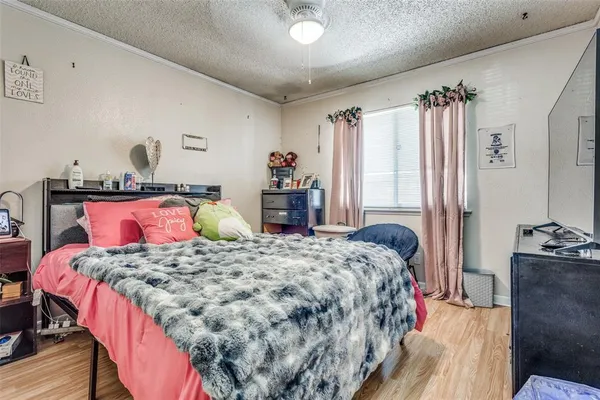 a bedroom with a bed and dresser