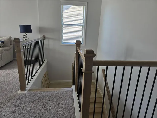 a view of a hallway with windows