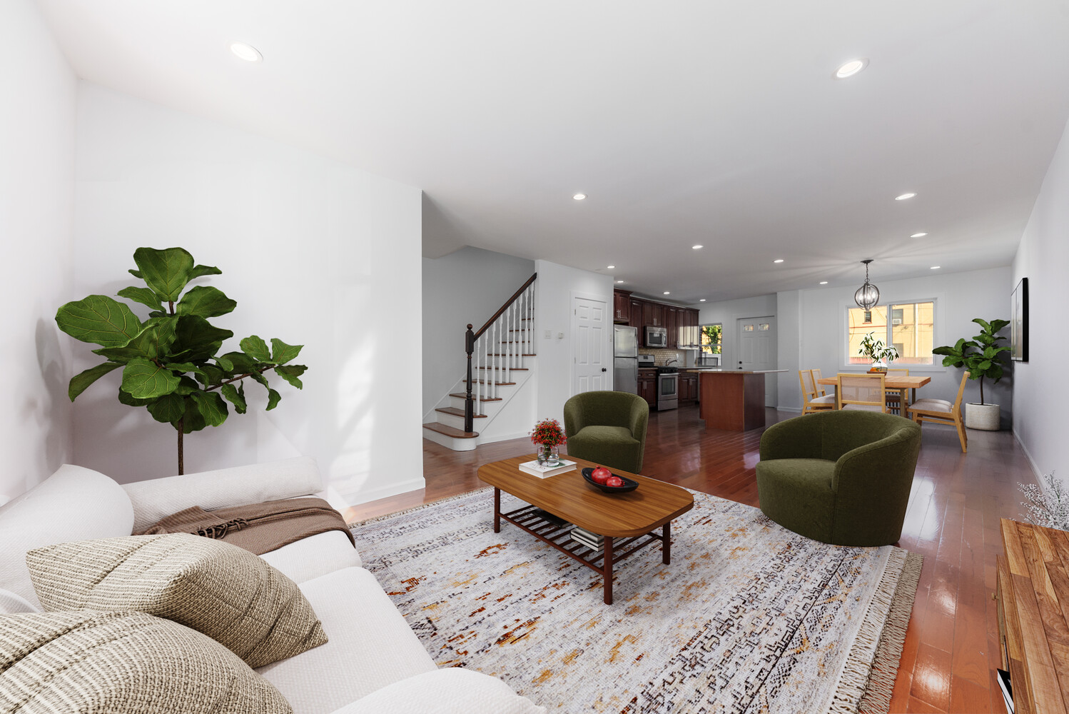 a living room with furniture and a potted plant