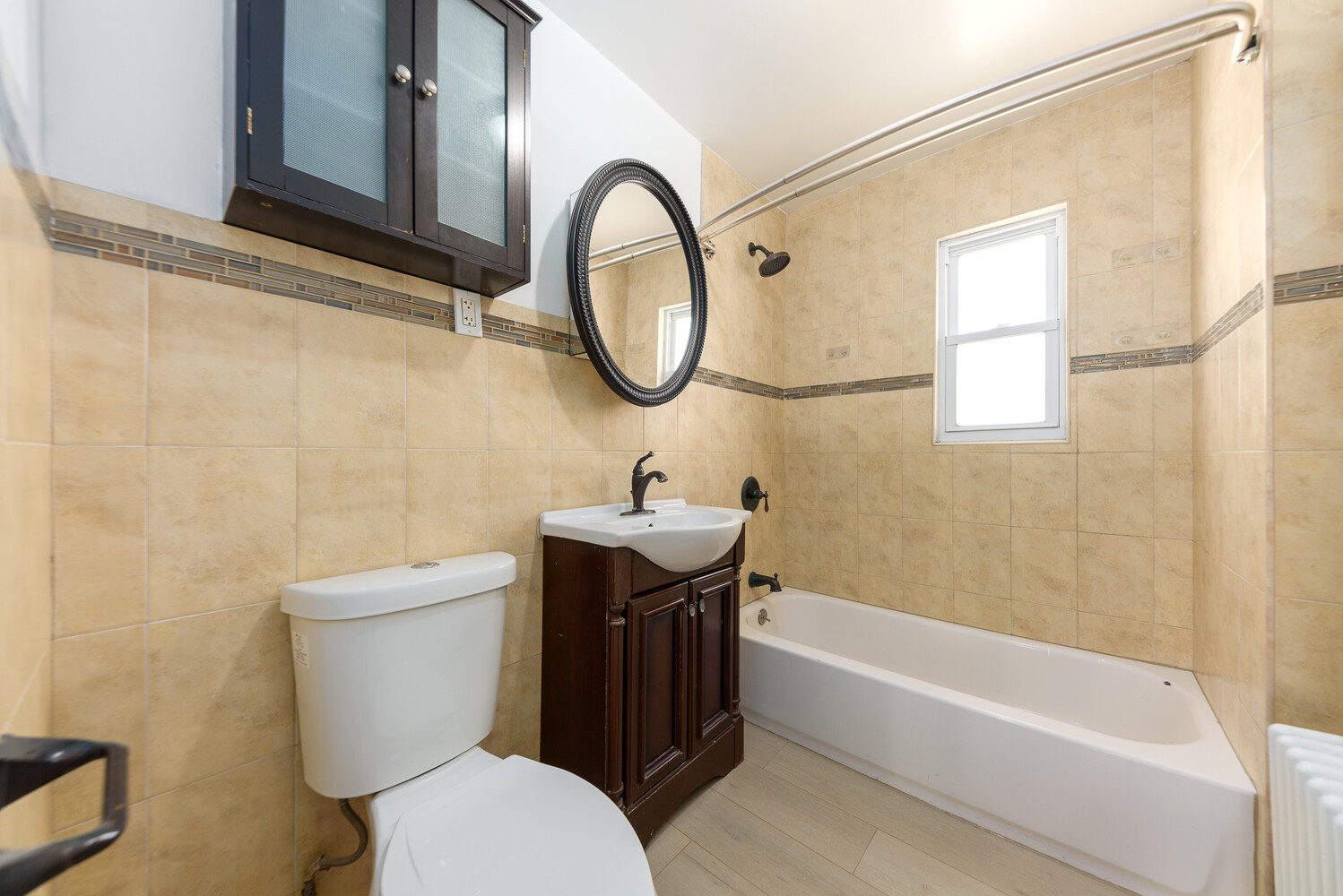 102 183rd Place Queens, NY 11423 - Photo 5 of 13 a bathroom with a sink a toilet and a bathtub