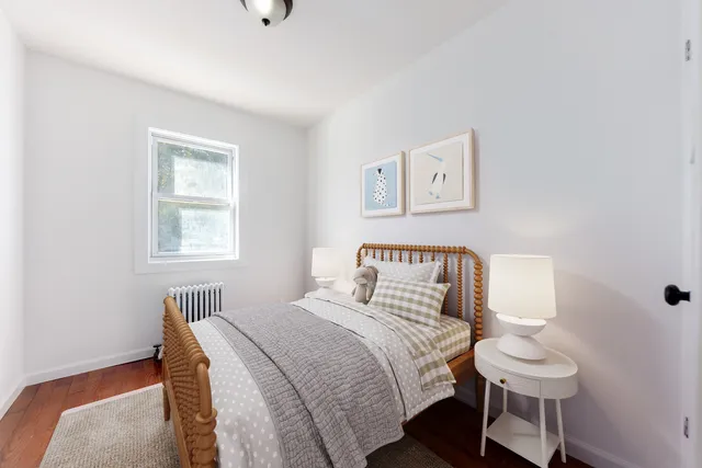 a bedroom with a bed and a book shelf