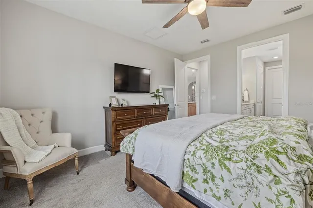 a bedroom with a bed and a television