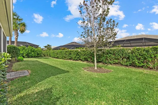 a view of a house with garden and yard
