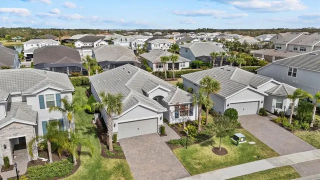 an aerial view of residential houses with outdoor space