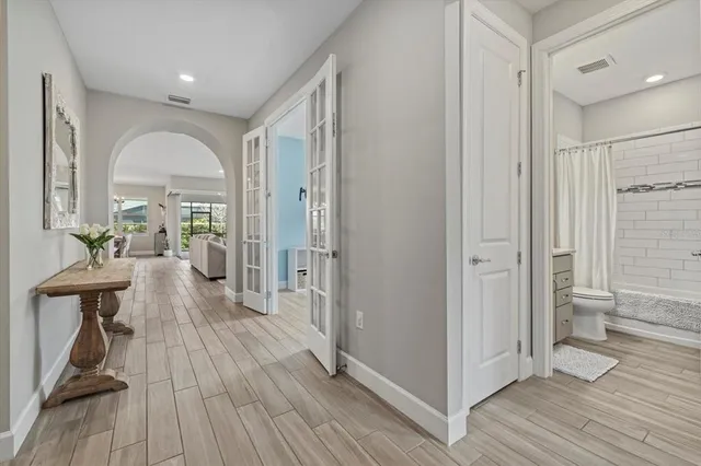 a view of a living room and a wooden floor