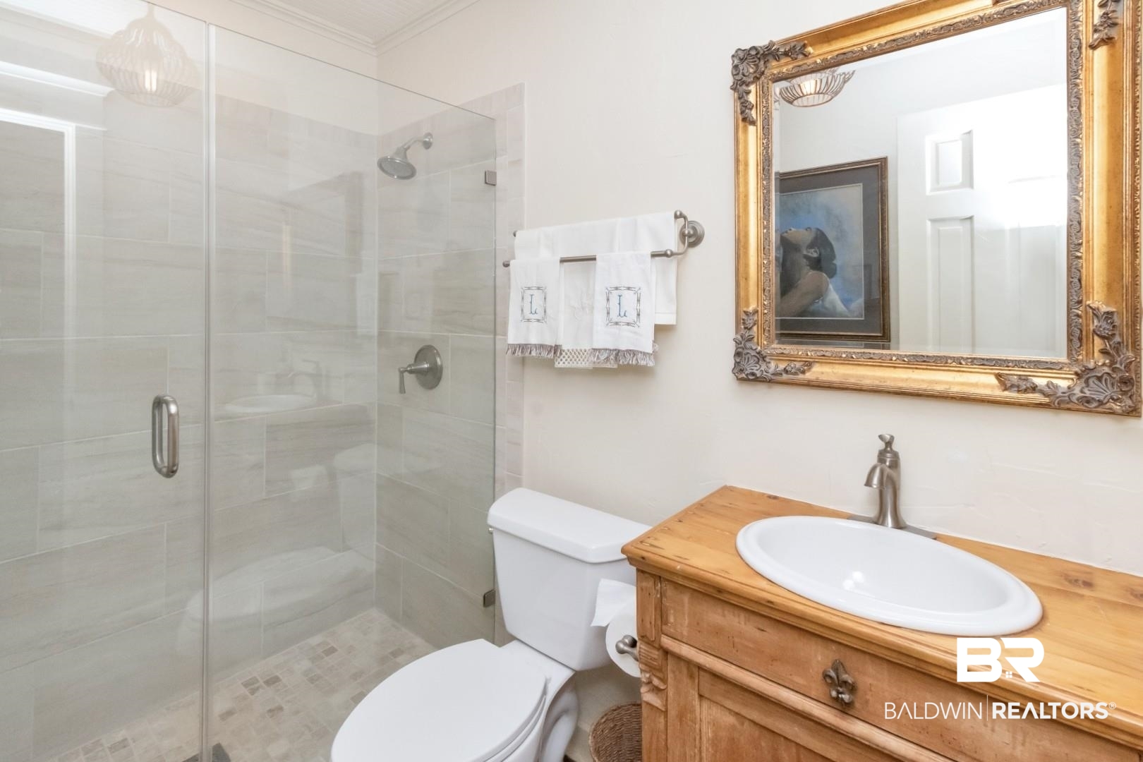 4810 Mums Court Mobile, AL 36608 - Photo 14 of 50 Bathroom with a stall shower, vanity, and ornamental molding