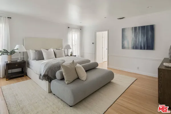 a living room with a bed and a couch