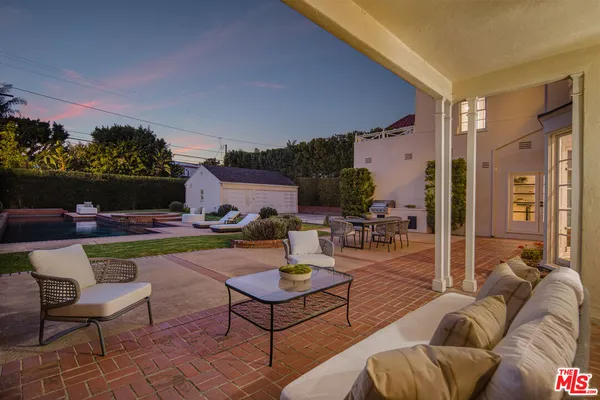 a outdoor space with patio the couches and a potted plant