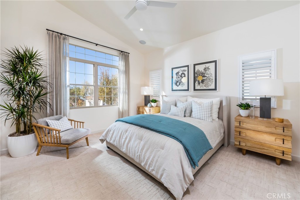 115 Anthem Irvine, CA 92618 - Photo 4 of 4 a spacious bedroom with a bed and a couch