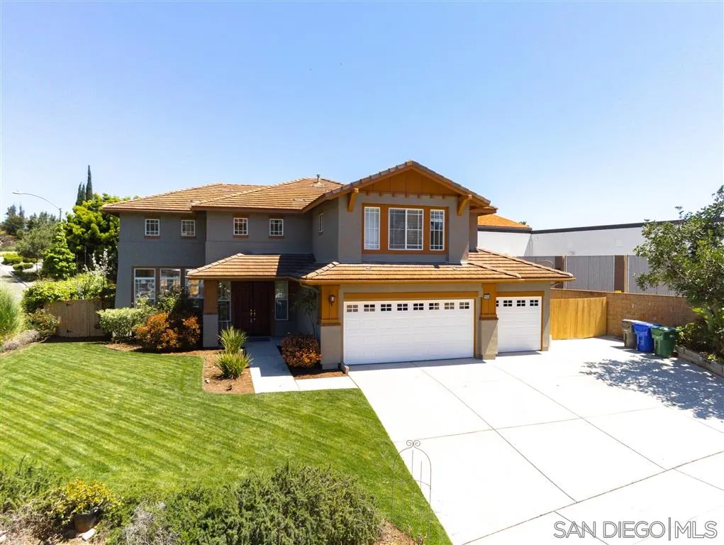 1935 Ivy Road Oceanside, CA 92054 - Photo 1 of 25 a front view of a building with a garden and parking space