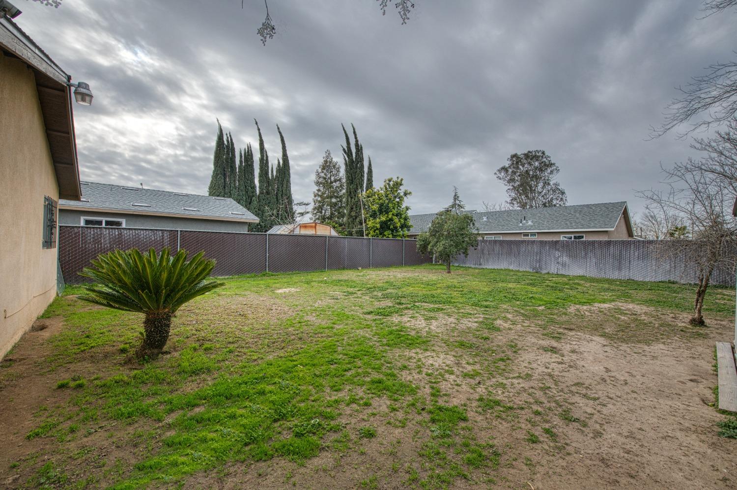 717 Clinton Street Madera, CA 93638 - Photo 35 of 38 a view of a yard in front of a house