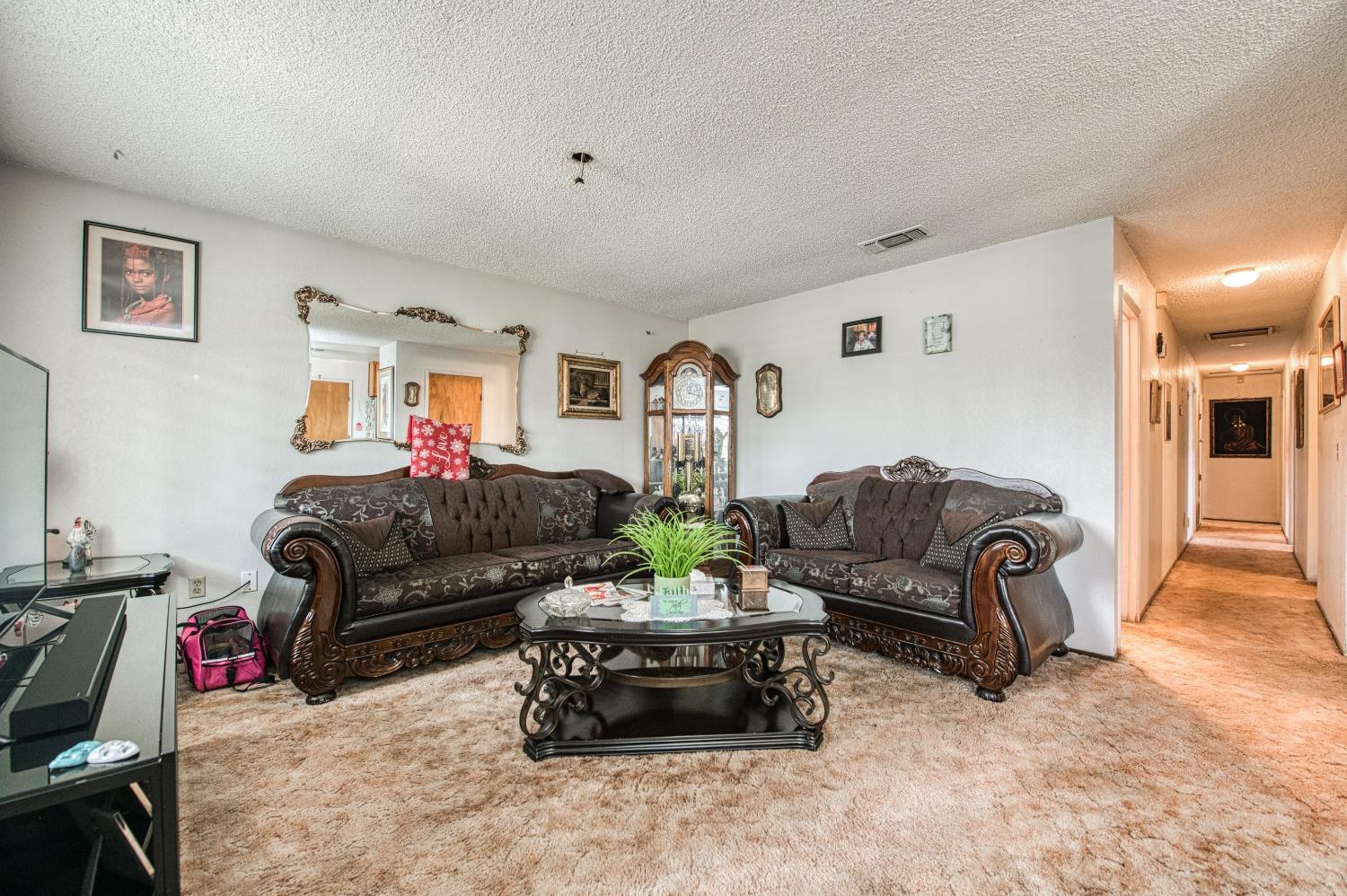 717 Clinton Street Madera, CA 93638 - Photo 9 of 38 a living room with furniture