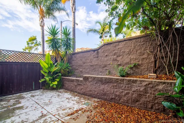 a view of a table and chairs under an umbrella