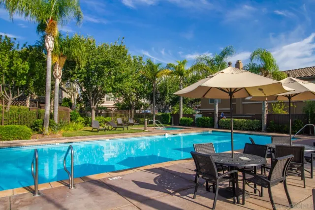 a view of a swimming pool with a patio