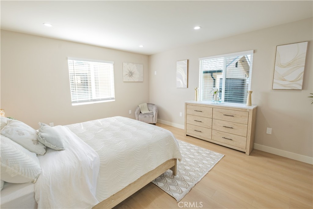 223 South Aprilia Avenue Compton, CA 90220 - Photo 27 of 46 a bedroom with a large bed and a window
