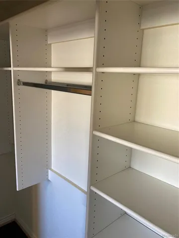 a bathroom with a sink toilet and a mirror