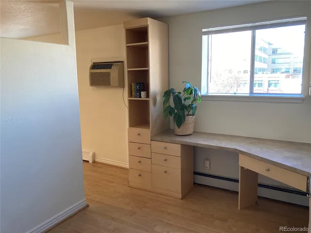 a kitchen with stainless steel appliances a cabinets and window